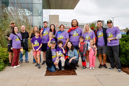 Group of people in purple shirts